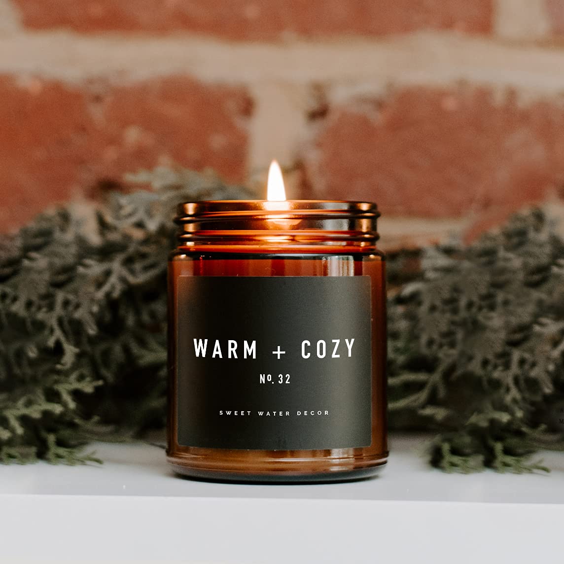 Sweet Water Decor Warm and Cozy Soy Candle - Orange Peel, Cinnamon, Ginger and Clove Scented Candles for Home - 9oz Amber Jar   Black Lid, 40  Hour Burn Time, Made in the USA